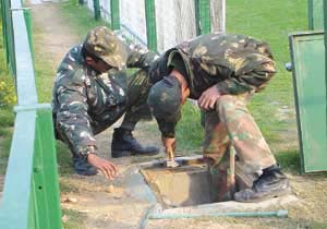 Army jawans inspect a sewer line as part of the ongoing R-Day security check