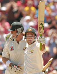Australian cricketers Ricky Ponting and Mathew Hayden celebrate their victory over India
