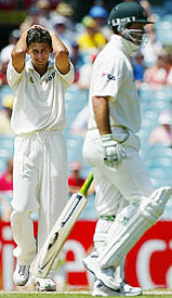 Ajit Agarkar reacts after Australias Ricky Ponting was nearly run out during the final day of the third Test at Melbourne.