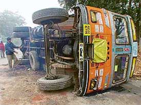 The truck that overturned due to foggy weather near the GMCH 32 roundabout