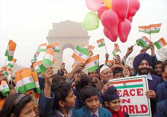Schoolchildren join the Chairman of the All-India Anti-Terrorist Front, Mr M.S. Bitta