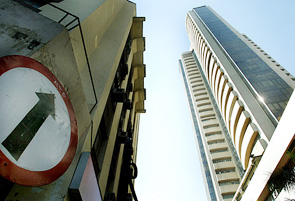 A traffic-sign near the Bombay Stock Exchange building reflects the sharp increase in the stock index