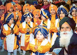Kids form part of a nagar kirtan taken out in connection with Gurpurb in Ludhiana on Saturday.