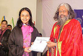 A student receives her management degree from the Vice-Chancellor of Punjab Technical University