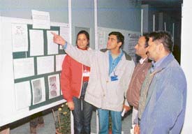 A research worker shows his work during a poster session as part of the Indian Science Congress