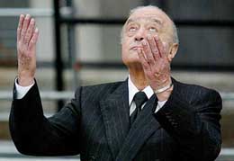 Mohamed Al-Fayed gestures as he leaves the opening of the British inquest into the 1997 death of Britains Princess Diana in central London on Tuesday.