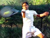 Mandeep Yadav plays a forehand shot to move into the under-14 quarter-final of the Total Tennis Tournament at YMCA, Sector 11, Chandigarh, on Friday. 