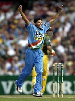 Ajit Agarkar celebrates taking the wicket of Australias Jason Gillespie