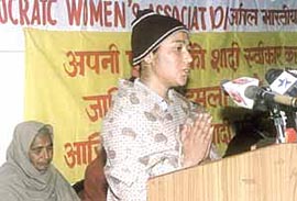 Geeta who lost her husband for marrying outside the caste at Jahan Khelan in Hoshiarpur district, addressing the delegates at a convention against Honour killings in the Capital on Sunday. Geetas mother-in-law is also seen in the picture. 