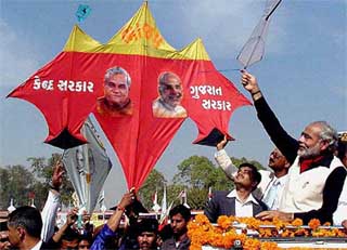 Gujarat Chief Minister Narendra Modi flies a kite during the inauguration ceremony of the International Kite Festival in Ahmedabad