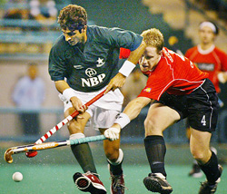 Pakistans Muhammad Saqlain is challenged by Germanys Philipp Crone during Sultan Azlan Shah Cup hockey tournament in Kuala Lumpur
