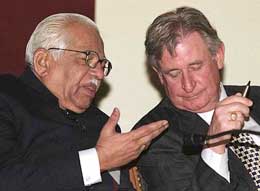 Mr Ram Naik, Union Minister for Petroleum & Natural Gas, talks to Mr Ralph Klein, Premier of Alberta, Canada, during the fifth Oil and Gas Conference in New Delhi 