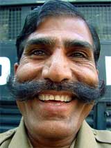 Policeman Chandan Singh Rajput smiles outside the police control room in Bhopal on Tuesday