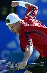 Australia's Lleyton Hewitt reacts during his match against Arnaud Clement of France in quarterfinal of the Sydney International tennis tournament 