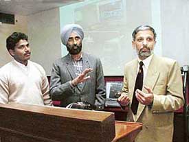 Prof G.D. Puri (right) of the PGI explains the system which will automatically administer drugs during surgery. On the left are the engineers of the SCL