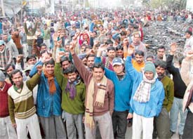 Industry workers hold a protest rally in Ludhiana