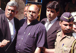 Sirajuddin Mohammed Ibrahim Desai, a South African high court judge who came to attend the World Social Forum, comes out of a court in Mumbai 