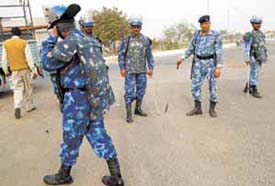 Jawans of the Rapid Action Force keeping a vigil on the Greater Noida-Dadri road on Monday.