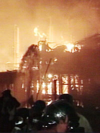 Firefighters tackle the blaze after an explosion at Algerias largest refinery and principal oil exporter in the port city of Skikda