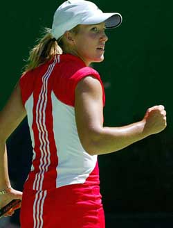 Top seed Belgium's Justine Henin-Hardenne celebrates winning a point against France's Camille Pin during their second round match