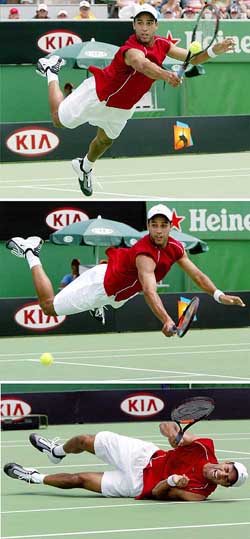 James Blake of the USA dives to play a shot against Ecuador's Nicolas Lapentti at the Australian Open in this combination photo