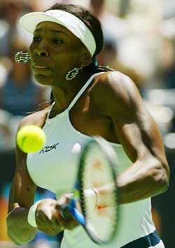 Third seed Venus Williams of the US hits a backhand to Russia's Vera Douchevina 