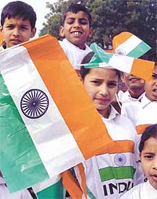 Schoolchildren holding the Tricolour at the launch of the Flag Foundation of India
