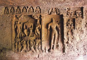 Carvings on a wall of the cave housing the stupa