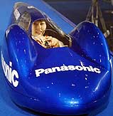 A woman drives a Panasonic luge-shaped vehicle operated by "Oxyride" dry batteries developed by Panasonic at an unveiling of the next generation batteries in Tokyo on Wednesday. 