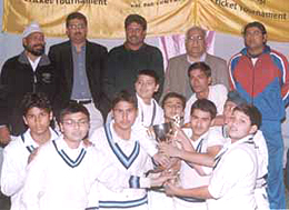 Former Indian cricket team captain Kapil Dev, Gyan Bharati School principal R C Shekhar and Gursharan Singh with the Gyan Bharati South Delhi Cricket Academy team who won the Young Achievers Cricket Tournament trophy.