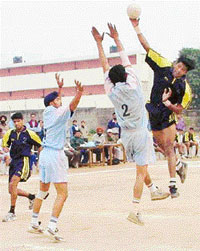 Sri Guru Gobind Singh College boys leap in the air in a handball match against DAV College played in Sector 26