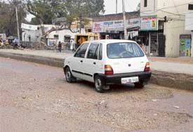 A large pothole on the road near the main bus stand of Ambala cantonment.