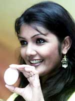 Former Miss India Shyla Lopez shows Organegg's herbal egg at a Press conference in New Delhi 