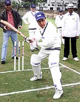 FICCI president Y.K. Modi plays the inaugural shot during FICCI and  Ministry of External Affairs cricket match