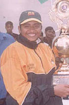 Captain Ramit Gill with the Rajiv Gandhi Memorial Cricket Trophy.
