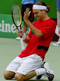 Second seed Roger Federer of Switzerland celebrates his win over Russias Marat Safin in their mens final match at the Australian Open