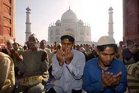 Muslims pray at the Shahi Masjid near the Taj Mahal during the Id festival in Agra on Monday.