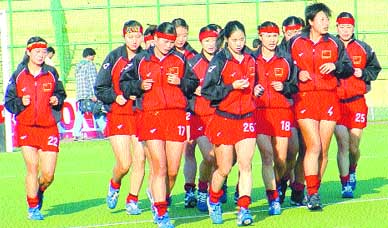 Chinas Red Brigade warm up before their Pool A match against India in the Asia Cup Womens Hockey Championship at the National Stadium