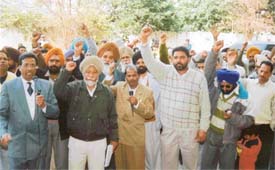 BSNL employees raise slogans against the authorities at a rally in front of the office of the GMT in Ludhiana
