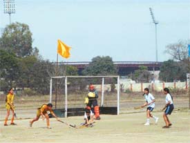 Players of Kila Raipur and Sports Club in action in the Ludhiana district women hockey meet in Ludhiana