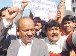 Delhi BJP chief Harshvardhan with party activists protesting against the failure of the Delhi Government to provide basic amenities in the Capital on Tuesday.  Tribune photo by Mukesh Aggarwal