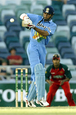 India's Hemang Badani hits a four off Andy Blignaut of Zimbabwe during their match in Perth 