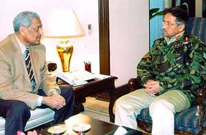 Pakistan President Gen Pervez Musharraf meets the countrys top nuclear scientist, Abdul Qadeer Khan, in Islamabad, on Wednesday. 