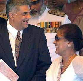 Sri Lankan President Chandrika Kumaratunga and Prime Minister Ranil Wickremesinghe share a light moment during Sri Lankas 56th independence celebration in Colombo 