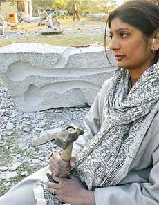 Sculptor Ratna Bhavsar in a reflective mood by the side of an image she is creating during the ongoing National Sculptors Workshop at the Leisure Valley, Sector 10, Chandigarh