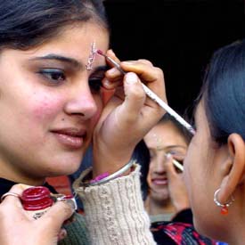 Students of Ramgarhia College take part in a bindi-making competition in Ludhiana on Thursday.