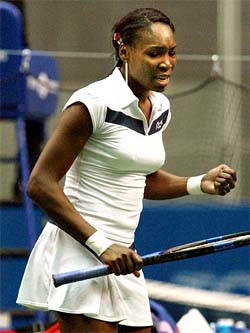 Venus Williams of the US clenches her fist as she celebrates defeating Japans Saori Obata 