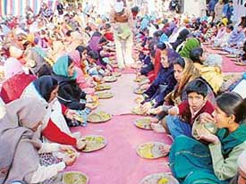Devotees partake of langar on the occasion of Guru Ravi Dass Jayanti in Sector 30, Chandigarh, on Friday.