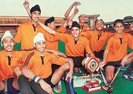 Hockey players of the Chandigarh Hockey Academy (white) in a jubilant mood after winning the six-a-side hockey title at the Sector 42 sports complex, Chandigarh, on Friday.