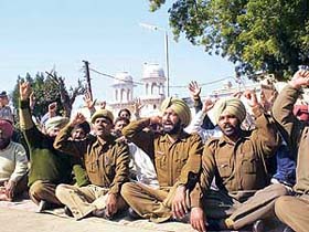 Suspended jail guards hold a dharna against the new policies of the Jail Superintendent in front of the main gate of the Central Jail, Patiala